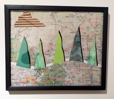 abstract landscape of hills and trees, incorporating recycled road maps